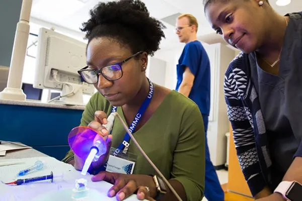 Two students working on a project in a lab.