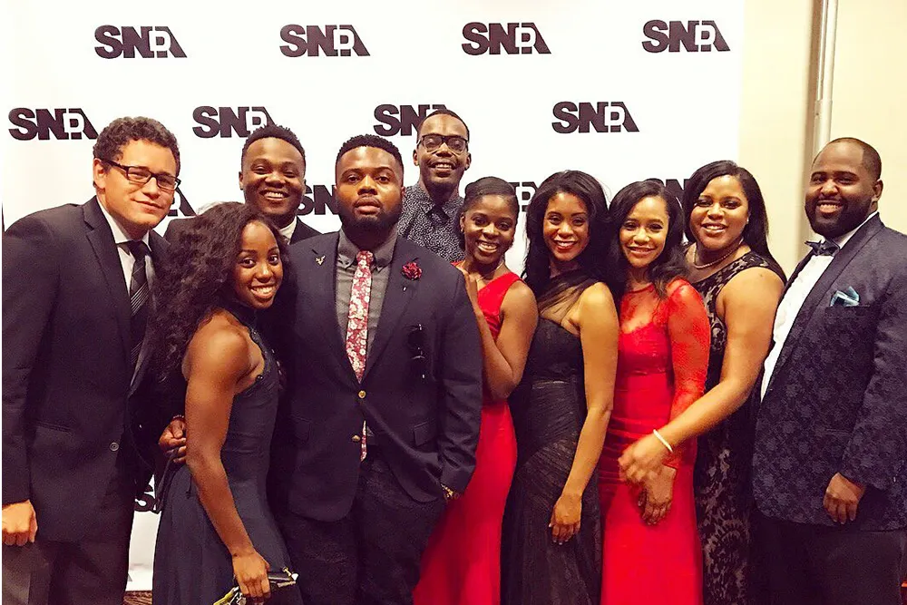 a group of people standing next to each other