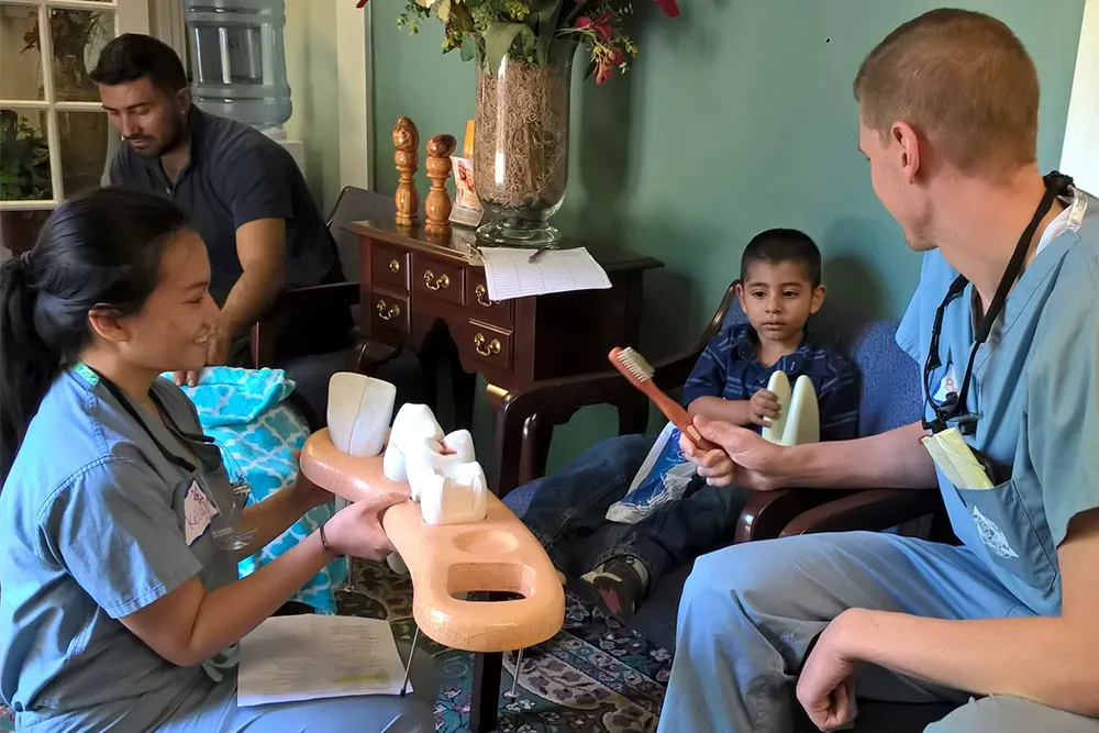 a group of people sitting around each other in a room