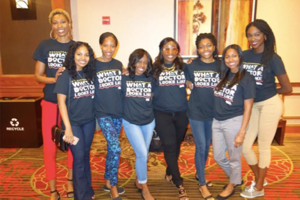 a group of women standing next to each other