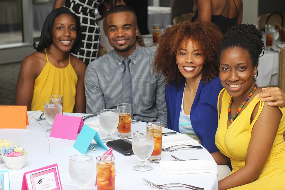 a group of people sitting around a table