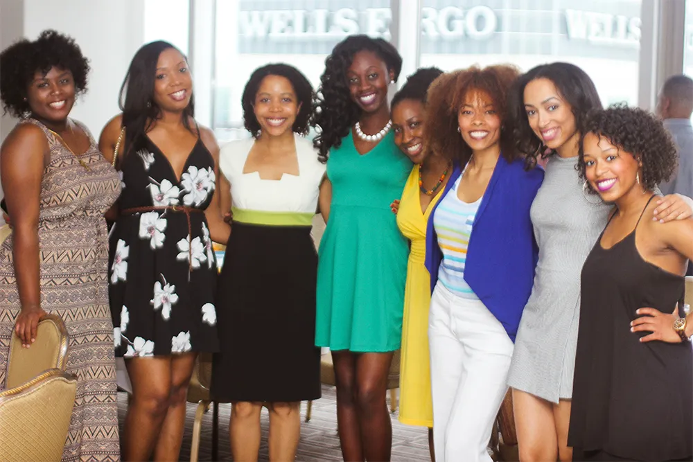 a group of women standing next to each other