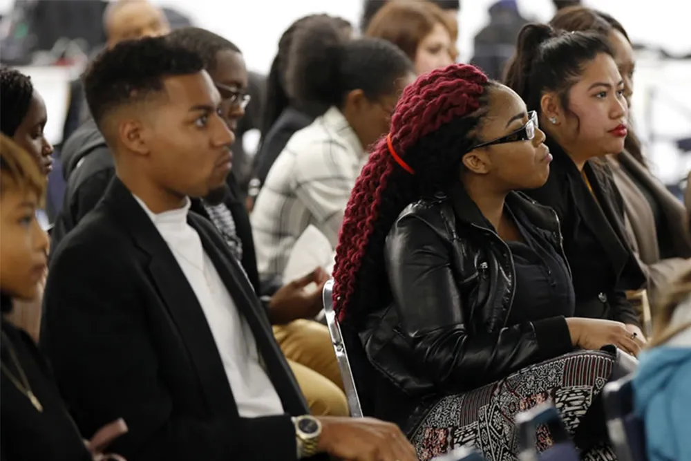 a group of people sitting next to each other