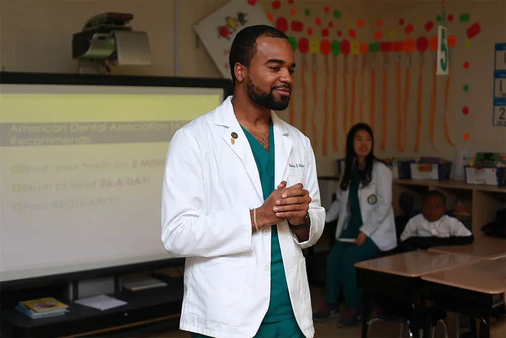 a man standing in front of a class room
