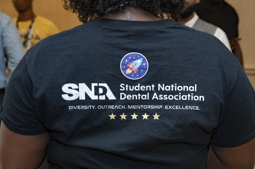 SNDA member wearing the association tee